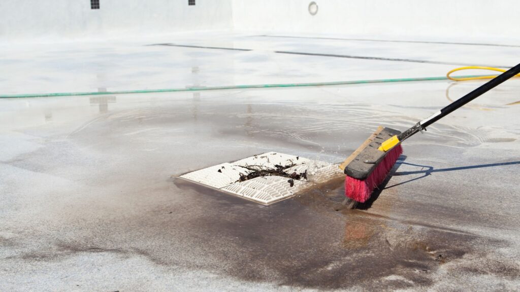 Drained Swimming Pool Cleaning with Broom